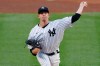 FILE - In this Aug. 2, 2020, file photo, New York Yankees starting pitcher James Paxton throws during the first inning of a baseball game against the Boston Red Sox in New York. Paxton is returning to the Seattle Mariners after an injury-filled second season with the Yankees. The 32-year-old left-hander and the Mariners agreed Saturday, Feb. 13, to an $8.5 million, one-year contract, a person with knowledge of the negotiations told The Associated Press. The person spoke on condition of anonymity because the agreement was subject to a successful physical.( AP Photo/Kathy Willens, File)