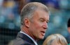 FILE - In this Aug. 3, 2018, file photo, Seattle Mariners president Kevin Mather stands on the field before the team's baseball game against the Toronto Blue Jays in Seattle. Mather apologized late Sunday night, Feb. 21, 2021, for comments made during a recent online event where he expressed opinions about organizational strategy, personnel moves and club finances. Mather’s comments came in a speech to the Bellevue, Wash., Breakfast Rotary Club on Feb. 5 and were posted online over the weekend. (AP Photo/Ted S. Warren, File)