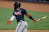 FILE - In this Aug. 16, 2020, file photo, Atlanta Braves' Marcell Ozuna watches his single during the first inning of a baseball game against the Miami Marlins in Miami. The Braves are bringing back Ozuna, signing the slugger to a $65 million, four-year contract. The Braves announced the deal for the 2020 NL home run and RBI leader Friday night, Feb. 5, less than two weeks before pitchers and catchers are set to report for spring training. The deal includes a fifth-year club option for $16 million with a $1 million buyout. (AP Photo/Lynne Sladky, File)