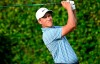 FILE - In this March 5, 2020, file photo, Cameron Champ watches his tee shot on the ninth hole during the first round of the Arnold Palmer Invitational golf tournament in Orlando, Fla. Champ tested positive for the coronavirus on June 23 but was allowed to return this week at the Rocket Mortgage Classic under an adjusted policy for players who test positive with no symptoms who then test negative twice 24 hours apart. (AP Photo/Phelan M. Ebenhack, File)
