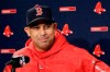 FILE- In this Oct. 21, 2018, file photo, Boston Red Sox manager Alex Cora speaks to media during a baseball work out at Fenway Park in Boston, as they prepare for the World Series against the Los Angeles Dodgers. The Red Sox rehired Cora as manager Friday, Nov. 6, 2020, less than a year after letting him go because of his role in the Houston Astros cheating scandal. (AP Photo/Elise Amendola, FIle)