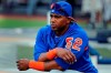 FILE - In this July 20, 2018, file photo, New York Mets' Yoenis Cespedes stretches before the team's baseball game against the New York Yankees in New York. It’s been a bizarre offseason for the Mets — even by their standards. They dumped two different managers, cut Cespedes’ salary, and ownership took a swing at selling a controlling share of the franchise before the proposed deal collapsed. (AP Photo/Julie Jacobson, File)