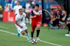 FILE - In this Aug. 10, 2019, file photo, FC Dallas defender Ryan Hollingshead plays the ball while Minnesota United forward Miguel Ibarra chases him during the first half of an MLS soccer match in Frisco, Texas. Hollingshead has been sheltering in place since Major League Soccer suspended the season because of the coronavirus outbreak. But his experience has been a bit different than other athletes in the same situation. He and his family have spent the time bonding with their foster son. (AP Photo/Roger Steinman, File)