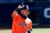 FILE - In this Oct. 12, 2020, file photo, Houston Astros' Carlos Correa celebrates after hitting a solo home run during the sixth inning in Game 2 of a baseball American League Championship Series, against the Tampa Bay Rays in San Diego. Correa and the Astros settled their arbitration case Saturday, Feb. 6, 2021, reaching a deal on a one-year contract for $11.7 million. Correa had asked for $12.5 million and the Astros had offered $9.75 million. (AP Photo/Jae C. Hong, File)