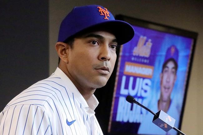 FILE - In this Jan. 24, 2020, file photo, New York Mets new manager Luis Rojas speaks during a baseball news conference after his introduction in New York. It’s been a bizarre offseason for the New York Mets — even by their standards. They dumped two different managers, cut Yoenis Céspedes’ salary, and ownership took a swing at selling a controlling share of the franchise before the proposed deal collapsed. (AP Photo/Bebeto Matthews, File)