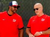 FILE - In this Feb. 17, 2020, file photo, Washington Nationals manager Dave Martinez, left, talks with general manager Mike Rizzo during spring training baseball practice in West Palm Beach, Fla. Martinez and the Nationals agreed to a multiyear contract extension that the team announced Saturday, Sept. 26, 2020. (AP Photo/Jeff Roberson, File)