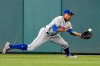 FILE - In this April 28, 2017, file photo, New York Mets center fielder Curtis Granderson makes a catch for an out on a drive by Washington Nationals' Wilmer Difo during the seventh inning of a baseball game in Washington. The three-time All-Star outfielder, who played for seven teams, announced his retirement Friday, Jan 31, 2020, after 16 seasons in the major leagues. (AP Photo/Nick Wass, File)