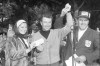 FILE - In this Jan. 31, 1966, file photo, John Keane, right, general chairman of the Lucky International Golf Tournament, raises the hand of Ken Venturi after presenting him with the winners check of $8,500 at Harding Park in San Francisco, Calif. Helping Ken hold the check is his wife, Connie. The PGA Tour made an annual stop at Harding Park in the 1960s, and it produced a pretty stout roll call of champions. The most popular winner was Venturi, who grew up in San Francisco playing the municipal course. (AP Photo/File)