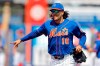 FILE - In this March 11, 2020, file photo, New York Mets center fielder Jake Marisnick gestures while running to the dugout prior to a spring training baseball game against the St. Louis Cardinals in Port S. Lucie, Fla. The Chicago Cubs added another outfielder on Thursday, Feb. 11, 2021, agreeing to a $1.5 million, one-year contract with Jake Marisnick. (AP Photo/Julio Cortez, File)