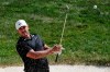 FILE - In this Saturday, July 18, 2020, file photo, Brooks Koepka hits from a bunker toward the 14th green during the third round of the Memorial golf tournament in Dublin, Ohio. The 3M Open comes to Minnesota for the second time, with heavy hitters Dustin Johnson and Brooks Koepka headlining the field. (AP Photo/Darron Cummings, File)