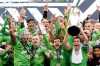 FILE - In this Nov. 10, 2019, file photo, Seattle Sounders captain Nicolas Lodeiro, right, lifts the MLS Cup trophy as he celebrates with teammates after the Sounders defeated Toronto FC in the MLS Cup championship soccer match in Seattle. Major League Soccer and its players have reached a new five-year collective bargaining agreement in time for the start of the season. The new contract must be approved by the MLS Board of Governors and the membership of the Major League Soccer Players Association. (AP Photo/Ted S. Warren, File)