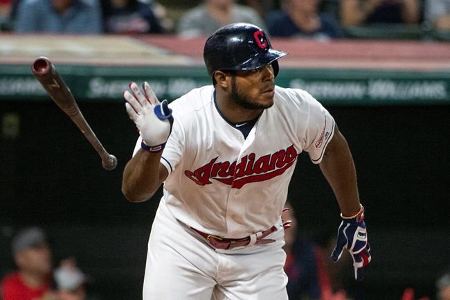 FILE - In this Sept. 22, 2019, file photo, Cleveland Indians' Yasiel Puig watches his three-run double off of Philadelphia Phillies relief pitcher Cole Irvin during the seventh inning of a baseball game in Cleveland. The free agent outfielder and the Atlanta Braves have agreed to a one-year deal, a person with knowledge of the deal said Tuesday, July 14, 2020. (AP Photo/Phil Long, File)