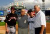 FILE - In this July 15, 2003, file photo, Cincinnati Reds' Aaron Boone, left, and his brother, Bret, from the Seattle Mariners, pose with their grandfather, Ray, and father, Bob, manager of the Cincinnati Reds, right, before the 74th All-Star Game at U.S. Cellular Field in Chicago. (AP Photo/Mark Duncan, File)