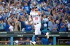 FILE- In this Oct. 9, 2019, file photo, Los Angeles Dodgers' Max Muncy celebrates his two-run home run against the Washington Nationals during the first inning in Game 5 of a baseball National League Division Series in Los Angeles. Muncy and the Dodgers agreed to a $26 million, three-year contract Thursday, Feb. 6, 2020, and avoided salary arbitration. (AP Photo/Mark J. Terrill, File)