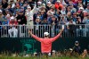 FILE - In this June 16, 2019, file photo, Gary Woodland celebrates in front of fans after winning the U.S. Open golf tournament in Pebble Beach, Calif. The USGA announced Wednesday, July 29, 2020, that no fans will be allowed at Winged Foot in New York on Sept. 17-20 for the U.S Open, noting that the decision was based on health and safety concerns from the COVID-19 pandemic. (AP Photo/Marcio Jose Sanchez, File)