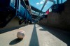 FILE - In this Sunday, July 26, 2020, file photo, a foul ball that was hit into the stands sits on the ground of an empty stadium during the eighth inning of a baseball game between the Miami Marlins and the Philadelphia Phillies in Philadelphia. The Marlins’ coronavirus outbreak could endanger the Major League Baseball season, Dr. Anthony Fauci said, as the number of their players testing positive rose to 15. The Marlins received positive test results for four additional players Tuesday, July 23, 2020, a person familiar with the situation told The Associated Press. The person declined to be identified because the results had not been publicly released. (AP Photo/Chris Szagola, File)