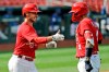 FILE - In this Wednesday, July 22, 2020, file photo, St. Louis Cardinals' Paul DeJong, left, is congratulated by teammate Yadier Molina after hitting a two-run home run during the fifth inning of an exhibition baseball game against the Kansas City Royals in St. Louis. The Cardinals announced Tuesday, Aug. 4, 2020, that DeJong and Molina are among six of the players who have tested positive for coronavirus. The others are infielders Edmundo Sosa and Rangel Ravelo, and pitchers Junior Fernandez and Kodi Whitley.(AP Photo/Jeff Roberson, File)