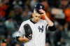 FILE - In this Oct. 18, 2019, file photo, New York Yankees starting pitcher James Paxton reacts after walking Houston Astros' Michael Brantley during the first inning in Game 5 of baseball's American League Championship Series in New York. Paxton has had back surgery and is expected to be sidelined until May or June. (AP Photo/Matt Slocum, File)