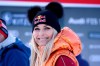 FILE- In this Friday, Jan. 24, 2020, file photo, Former ski star Lindsey Vonn, of United States, smiles in the finish area during the men's World Cup super G alpine ski race in Kitzbuehel, Austria. Vonn, the winningest woman in World Cup history, is scheduled to call the women’s downhill and super-G races in Crans Montana, Switzerland, this weekend for NBC Sports. (AP Photo/Marco Trovati, File)