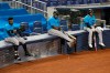 FILE - In this July 12, 2020, file photo, Miami Marlins' Jonathan Villar, left, Jesus Aguilar, center, and Jon Berti wait to bat during a baseball scrimmage at Marlins Park in Miami. Marlins CEO Derek Jeter blamed the team's coronavirus outbreak on a collective false sense of security that made players lax about social distancing and wearing masks. Infected were 21 members of the team's traveling party, including at least 18 players. None is seriously ill, Jeter said Monday, and he expects all to return this season. (AP Photo/Lynne Sladky, File)