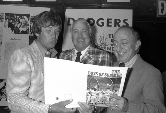 FILE - In this June 24, 1982, file photo, author Roger Kahn, right, joins former Brooklyn Dodger outfielder Duke Snider, center, and former Dodger pitcher, Clem Labine, at the start of production on the television film based on Kahn's best selling book,
