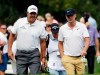 FILE - In this Aug. 15, 2019, file photo, Phil Mickelson, left, talks with Keith Mitchell during the first round of the BMW Championship golf tournament at Medinah Country Club in Medinah, Ill. Mitchell needs to be sharp this week at the AT&T Pebble Beach Pro-Am, mainly because Mickelson is in the field and he is expecting retribution when he leasts expects it. In his third year on tour, Mitchell has plenty of experience with pranks, not only dishing them out but avoiding them. (AP Photo/Nam Y. Huh, File)