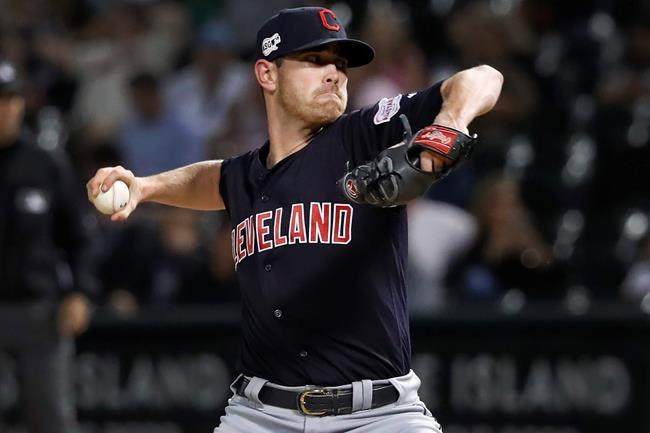 FILE - In this Sept. 25, 2019, file photo, Cleveland Indians starting pitcher Shane Bieber delivers during the first inning of the team's baseball game against the Chicago White Sox in Chicago. (AP Photo/Charles Rex Arbogast, File)