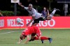 Montreal Impact defender Rod Fanni (7) and Toronto FC forward Jacob Shaffelburg (24) battle for a head ball during the second half of an MLS soccer match, Thursday, July 16, 2020, in Kissimmee, Fla. (AP Photo/John Raoux)