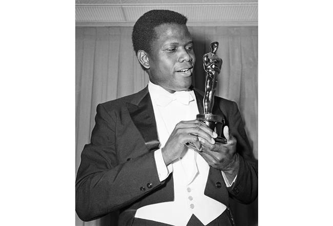 FILE - Actor Sidney Poitier appears with his Oscar for best actor, for his role in