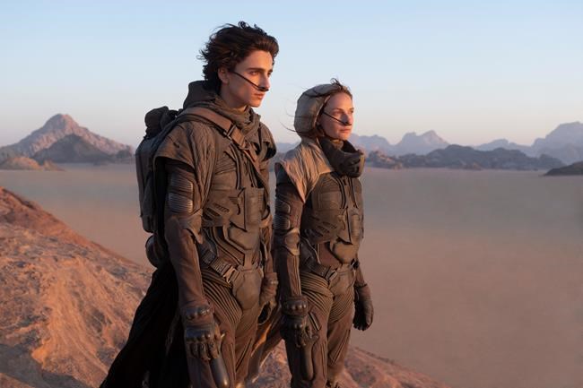 This image released by Warner Bros. Entertainment shows Timothee Chalamet, left, and Rebecca Ferguson in a scene from