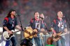 FILE - This Oct. 9, 2014 file photo shows The Eli Young Band performing during halftime of an NFL football game in Houston. The band will perform as part of the Concert in Your Car series at the new Texas Rangers stadium ,Globe Life Field, in Arlington, Texas starting June 4. (AP Photo/Patric Schneider, File)