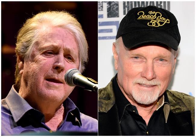This combination photo shows Brian Wilson performing at the Rosemont Theatre in Rosemont, Ill, on Oct 6, 2017, left, and Mike Love at
