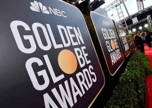 FILE - Event signage appears above the red carpet at the 77th annual Golden Globe Awards, Sunday, Jan. 5, 2020, in Beverly Hills, Calif. Nominations for the 78th annual Golden Globes will be announced on Wednesday, Feb. 2, 2021. (Photo by Jordan Strauss/Invision/AP, File)