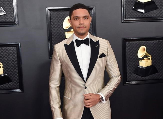 FILE - Trevor Noah arrives at the 62nd annual Grammy Awards in Los Angeles on Jan. 26, 2020. Noah will host the 2021 Grammy Awards on Sunday. (Photo by Jordan Strauss/Invision/AP, File)