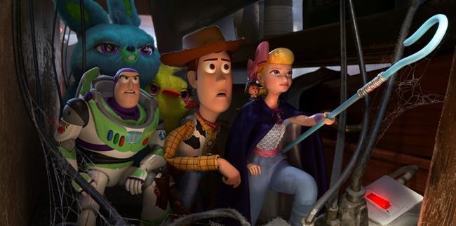 This image released by Disney shows, foreground from left, Buzz Lightyear, voiced by Tim Allen, Woody, voiced by Tom Hanks and Bo Peep, voiced by Annie Potts in a scene from the Oscar-nominated animated film