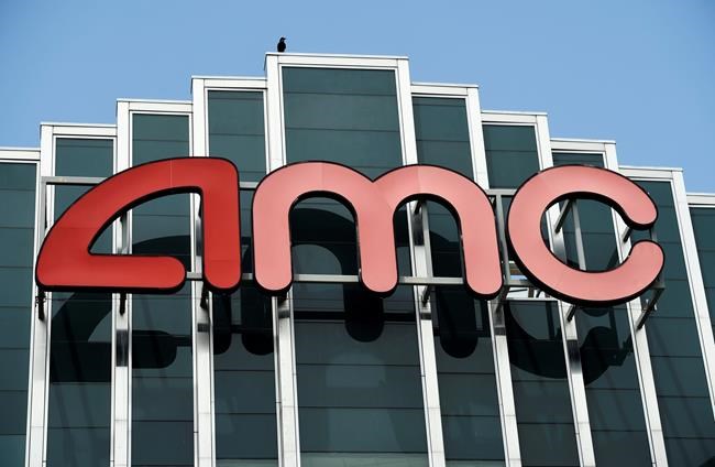 FILE - In this April 29, 2020 file photo, the AMC sign appears at AMC Burbank 16 movie theater complex in Burbank, Calif. The nation’s largest movie theater chain changed its position on mask-wearing less than a day after the company became a target on social media for saying it would defer to local governments on the issue. AMC Theaters CEO Adam Aron said Friday that its theaters will require patrons to wear masks upon reopening, which will begin in July. (AP Photo/Chris Pizzello, File)