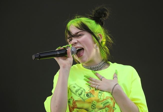 FILE - In this Oct. 5, 2019 photo, Billie Eilish performs during the first weekend of the Austin City Limits Music Festival in Zilker Park in Austin, Texas. Eilish will perform at this month's Grammy Awards. (Photo by Jack Plunkett/Invision/AP, File)