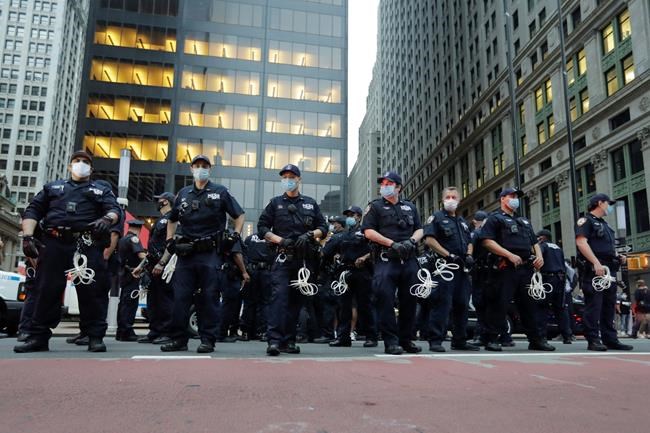 Police Officers watch over protesters during a rally over the death of George Floyd, a black man who was in police custody in Minneapolis Thursday, May 28, 2020, in New York. Floyd died after being restrained by Minneapolis police officers on Memorial Day. (AP Photo/Frank Franklin II)