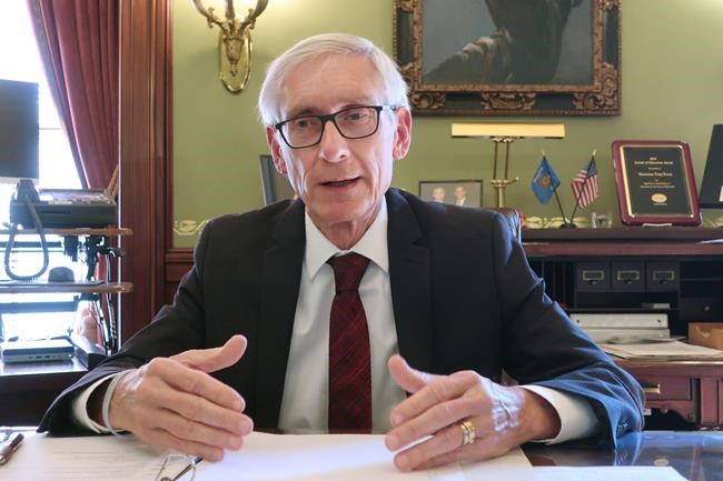 FILE - In this Dec. 4, 2019 file photo, Wisconsin Gov. Tony Evers speaks during an interview with The Associated Press in his Statehouse office in Madison, Wis. Evers' administration overstepped its authority when it unilaterally extended the governor's stay-at-home order through the end of May, the state Supreme Court ruled Wednesday, May 13, 2020. (AP Photo/Scott Bauer, File)
