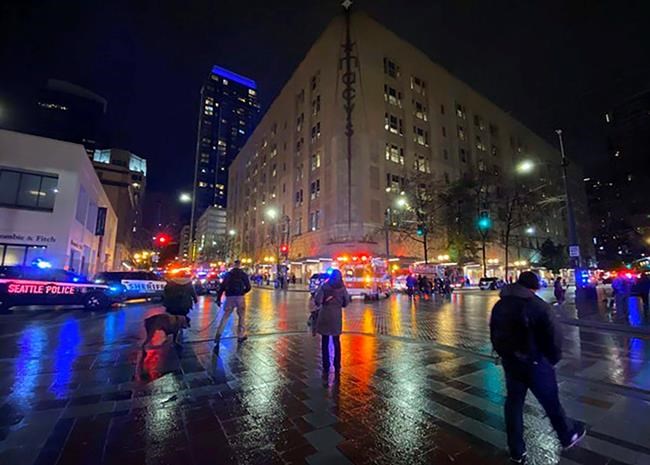 This photo provided by Suzanne Asprea shows the area of a deadly shooting in downtown Seattle on Wednesday, Jan. 22, 2020. A gunman opened fire in downtown Seattle on Wednesday night, killing at least one person and wounding several others, authorities said. Police Chief Carmen Best said what they believe is a lone suspect fled and police are searching for him. (Suzanne Asprea via AP)
