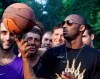FILE - In this Sept. 28, 2011, file photo, U.S. basketball star Kobe Bryant plays with a ball during a sponsor's appearance in Milan, Italy. In Europe where Bryant grew up, the retired NBA star is being remembered for his 