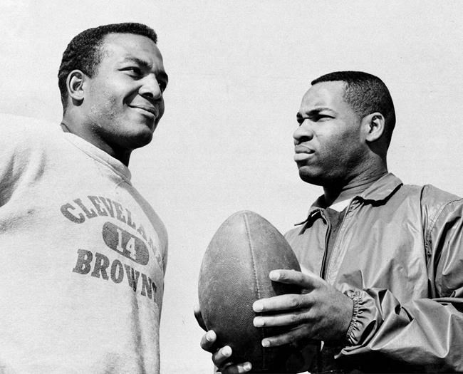 Fullback Jim Brown, left, and flanker back Bobby Mitchell, prepare for the annual Pro Bowl at Los Angeles in 1964. (Harold Filan / The Associated Press files)