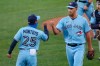 Toronto Blue Jays closing pitcher A.J. Cole and manager Charlie Montoyo celebrate a win over the Philadelphia Phillies following the second game of a baseball doubleheader, Thursday, Aug. 20, 2020, in Buffalo, N.Y. (AP Photo/Jeffrey T. Barnes)