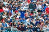 A spectator holds a sign during the third inning of a baseball game between the Toronto Blue Jays and the Boston Red Sox on Wednesday, July 21, 2021, in Buffalo, N.Y. (AP Photo/Joshua Bessex)