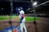 Toronto Blue Jays' Teoscar Hernandez waves to young fans calling his name during the sixth inning of a baseball game against the Baltimore Orioles in Buffalo, N.Y., Thursday, June 24, 2021. (AP Photo/Joshua Bessex)