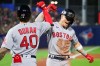 Boston Red Sox's Jarren Duran (40) celebrates with Enrique Hernandez after Hernandez hit a home run during the sixth inning of a baseball game against the Toronto Blue Jays on Monday, July 19, 2021, in Buffalo, N.Y. (AP Photo/Joshua Bessex)