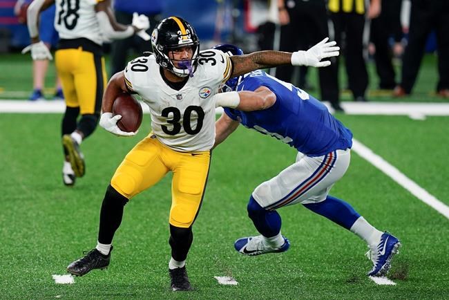 Pittsburgh Steelers running back James Conner (30) runs the ball against the New York Giants during the second quarter of an NFL football game Monday, Sept. 14, 2020, in East Rutherford, N.J. (AP Photo/Seth Wenig)