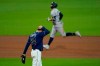 Tampa Bay Rays pitcher John Curtiss (84) reacts after giving up a grand slam home run to New York Yankees designated hitter Giancarlo Stanton during the ninth inning in Game one of a baseball American League Division Series Monday, Oct. 5, 2020, in San Diego. (AP Photo/Gregory Bull)