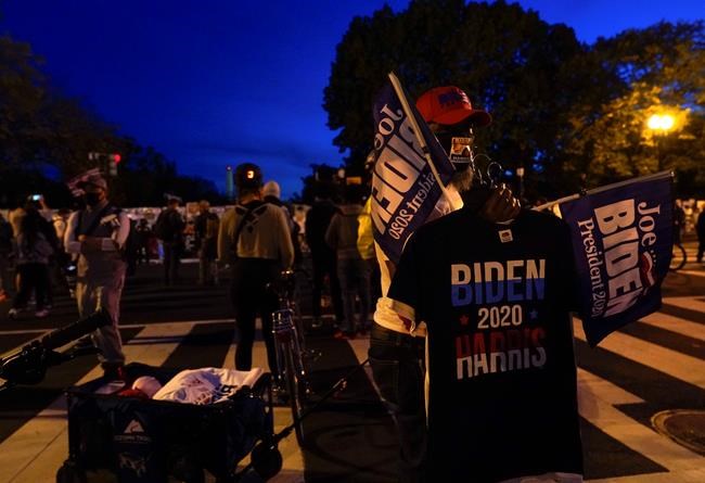 A vendor sells t-shirts supporting Democratic presidential candidate Joe Biden, Thursday, Nov. 5, 2020, in Washington. (AP Photo/Jacquelyn Martin)