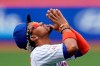 New York Mets shortstop Francisco Lindor reacts after the national anthem was played before a baseball game against the Miami Marlins, Saturday, April 10, 2021, in New York. (AP Photo/John Minchillo)